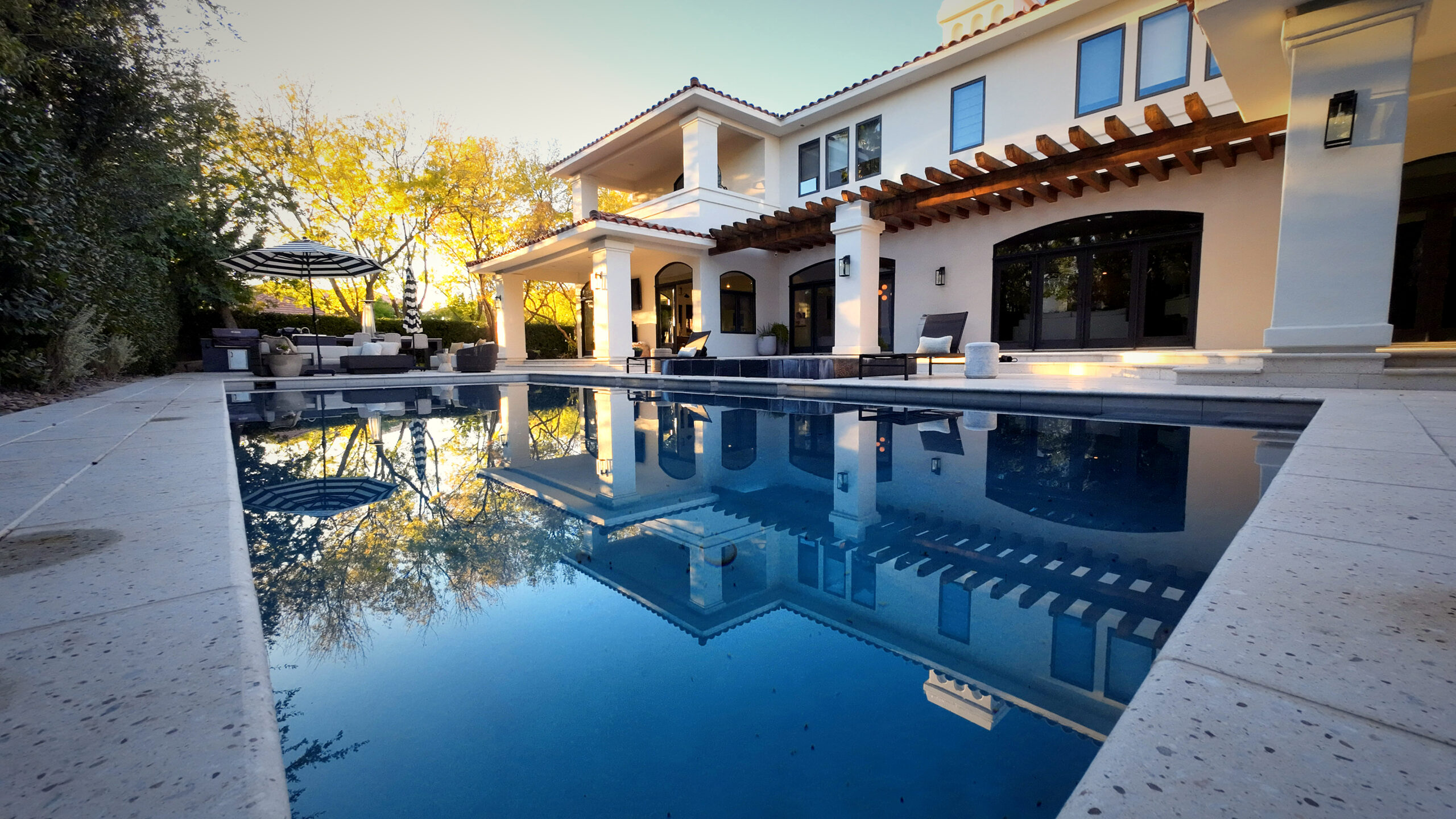 Aerial view of a custom luxury gunite pool and outdoor living space built by Paragon Pools in Southern Utah's red rock landscape